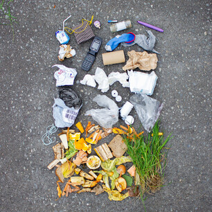 Editorial photography for Living Lightly book by Nicola Turner flat lay of rubbish on concrete