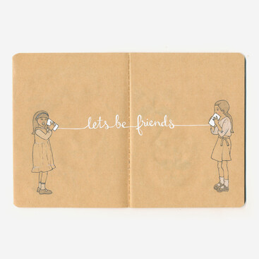 Kraft paper notebook sketch of two girls and tin can phone saying "lets be friends"