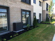 Standard Heat pump cover outdoor unit in garden. Retirement Village