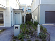 Multiple heat pump covers in garden. Wall hung