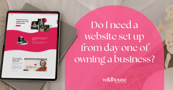 Tablet displaying a website with the question, 'Do I need a website set up from day one of owning a business?' in a pink overlay, alongside the Wildhouse Design Studio logo