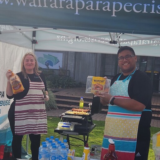 Wairarapa Rape and Sexual Abuse Collective Inc. team at 2025 Rape awareness week hosting a sausage sizzle in a branded tent