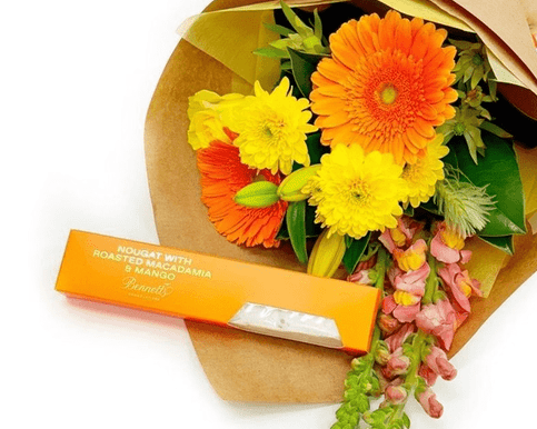 Colourful bouquet with nougat treats, perfect for a joyful celebration