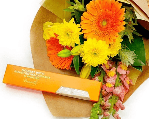Colourful bouquet with nougat treats, perfect for a joyful celebration