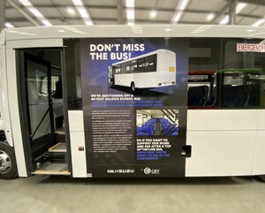 Advertisement vehicle graphics on side of bus