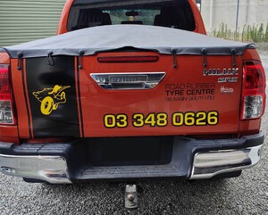 Vehicle graphics on back of Road Rubber Tyre Centre vehicle alternate design
