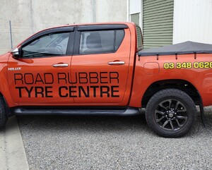 vehicle graphics on left side of Road Rubber Tyre Centre vehicle alterante design