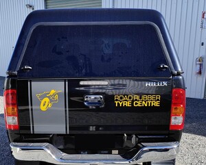Vehicle graphics on back of Road Rubber Tyre Centre vehicle