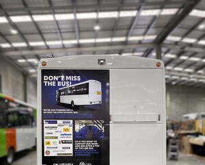 Advertisement vehicle graphics on back of bus