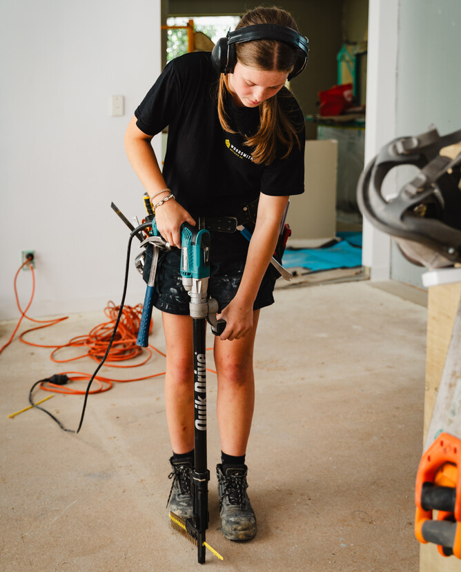 Poppy on the tools at a Woodsmith buidling project