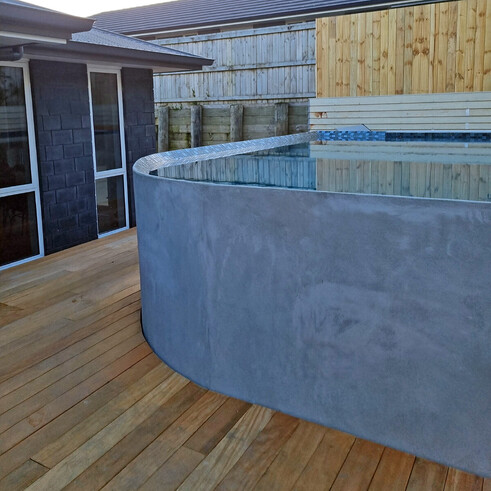 deck surrounding a pool