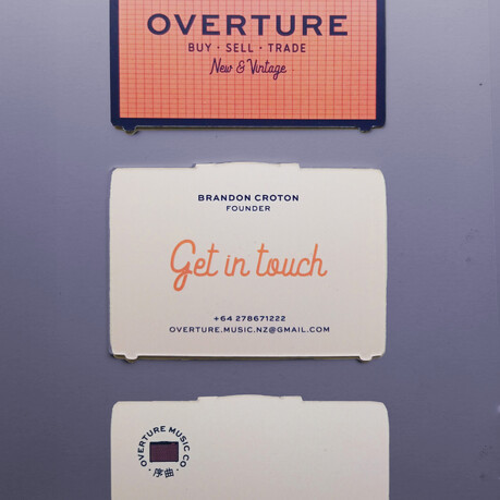 Custom shape business cards designed for Overture Music, cards are in the shape of amps