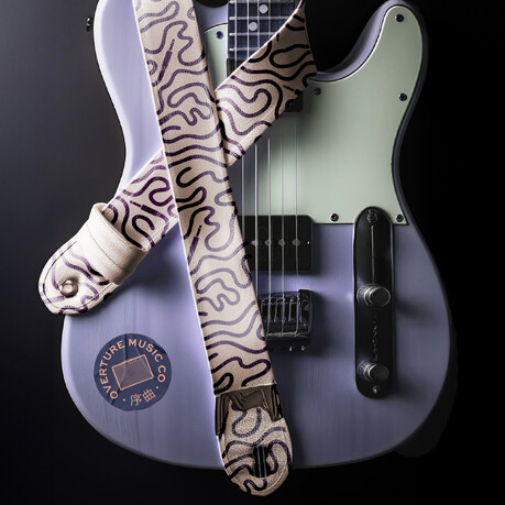 Custom guitar strap design for 'Overture Music', showcasing a custom pattern made up of squiggly guitar amp leads.