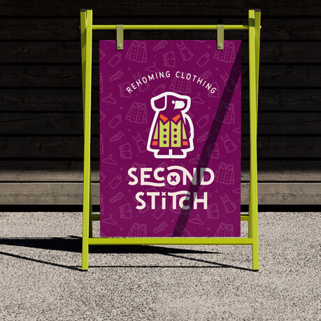 A-stand signage design for Second Stitch clothing, featuring bold branding and dog logo