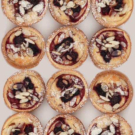 This is a photo of tarts they are called apple blackcurrant and frangipane tarts they are both gluten-free and dairy free