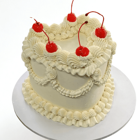 Gluten-free decorative unicorn cake with rainbow mane pink ears and gold horn