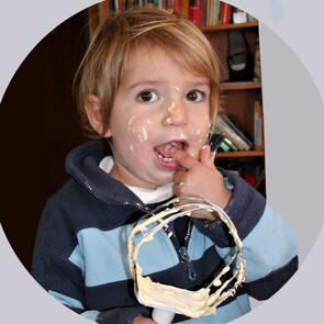 Sabine's daughter as a toddler licking the beater after baking