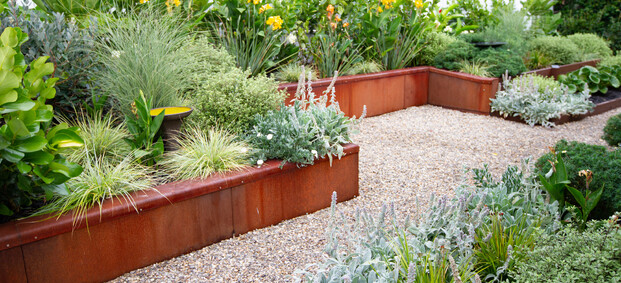 corten steel wall and mixed planting