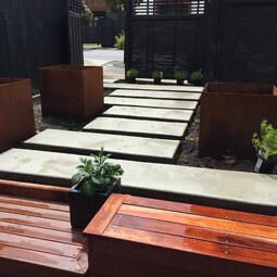corten steel planters & concrete stepping pavers