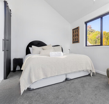 Super king bed in master bedroom at Roam Taupo