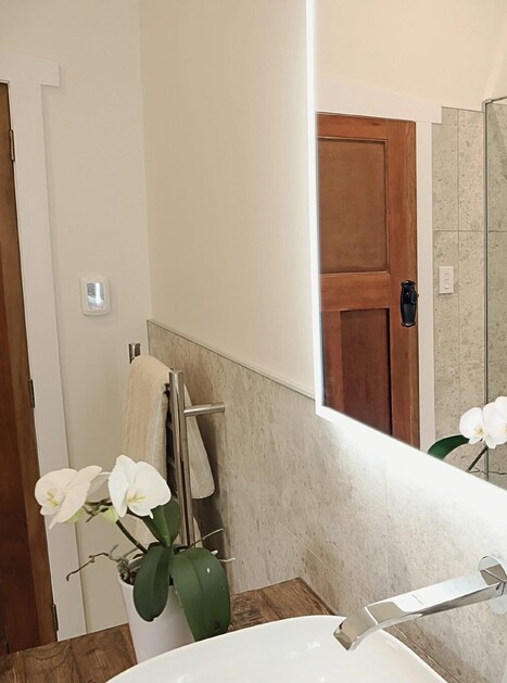 Bathroom shower reflected in mirror