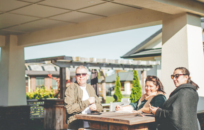 Sean O'Neill, Karlina Mitchell & Sarah-Jayne Shine working away in the sunshine at Speldhurst in Horowhenua. Photo by The Nomad Creative.