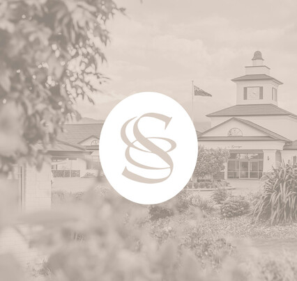 White monogram on image of The George, Speldhurst estate