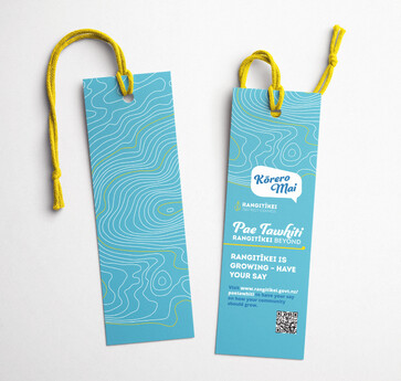 2 light blue bookmarks with information about the consultation displayed on light blue with yellow rope