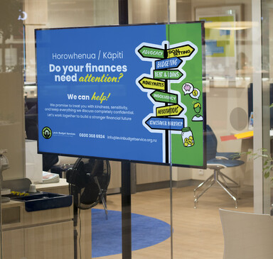 TV with a digital ad for the Levin Budget Service displayed