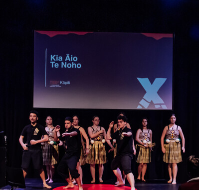 Presentation graphics on the screen at TEDx