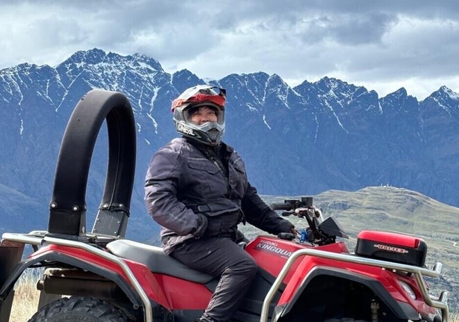 Syahidah riding a 4x4 ATV through New Zealand’s scenic outdoors
