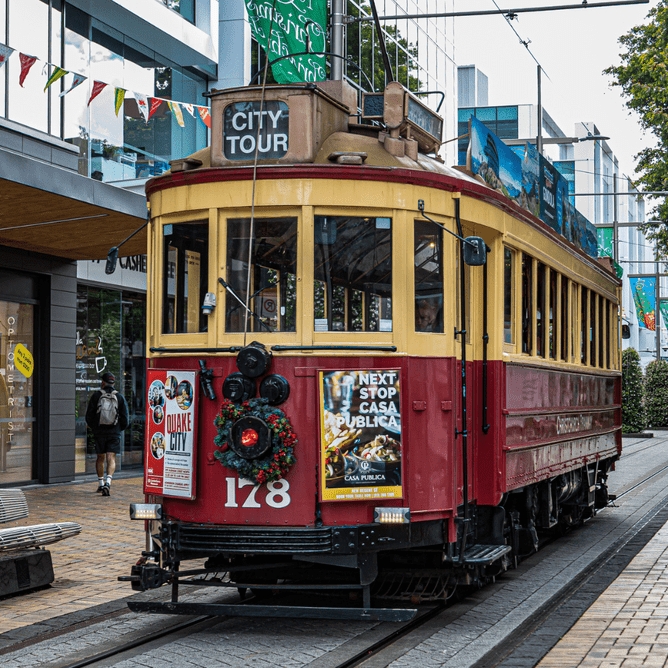 Historic Christchurch city tour tram passing through central streets