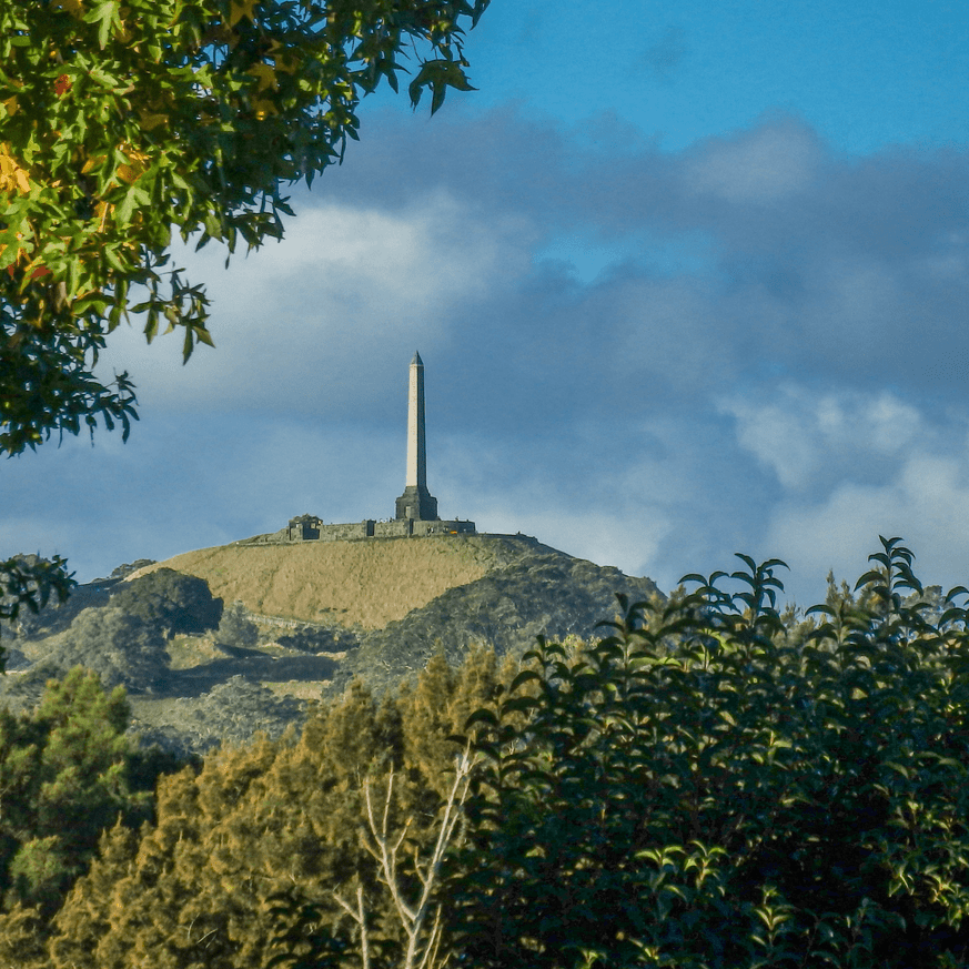 One Tree Hill in Auckland, New Zealand, with a clear sky