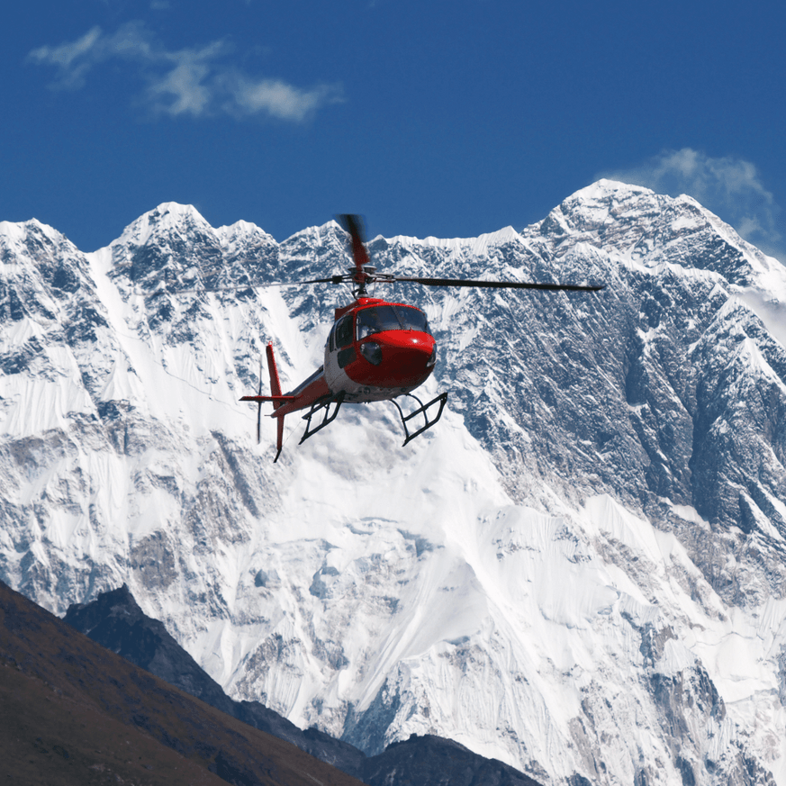 Helicopter flying with snowy Southern Alps in the background