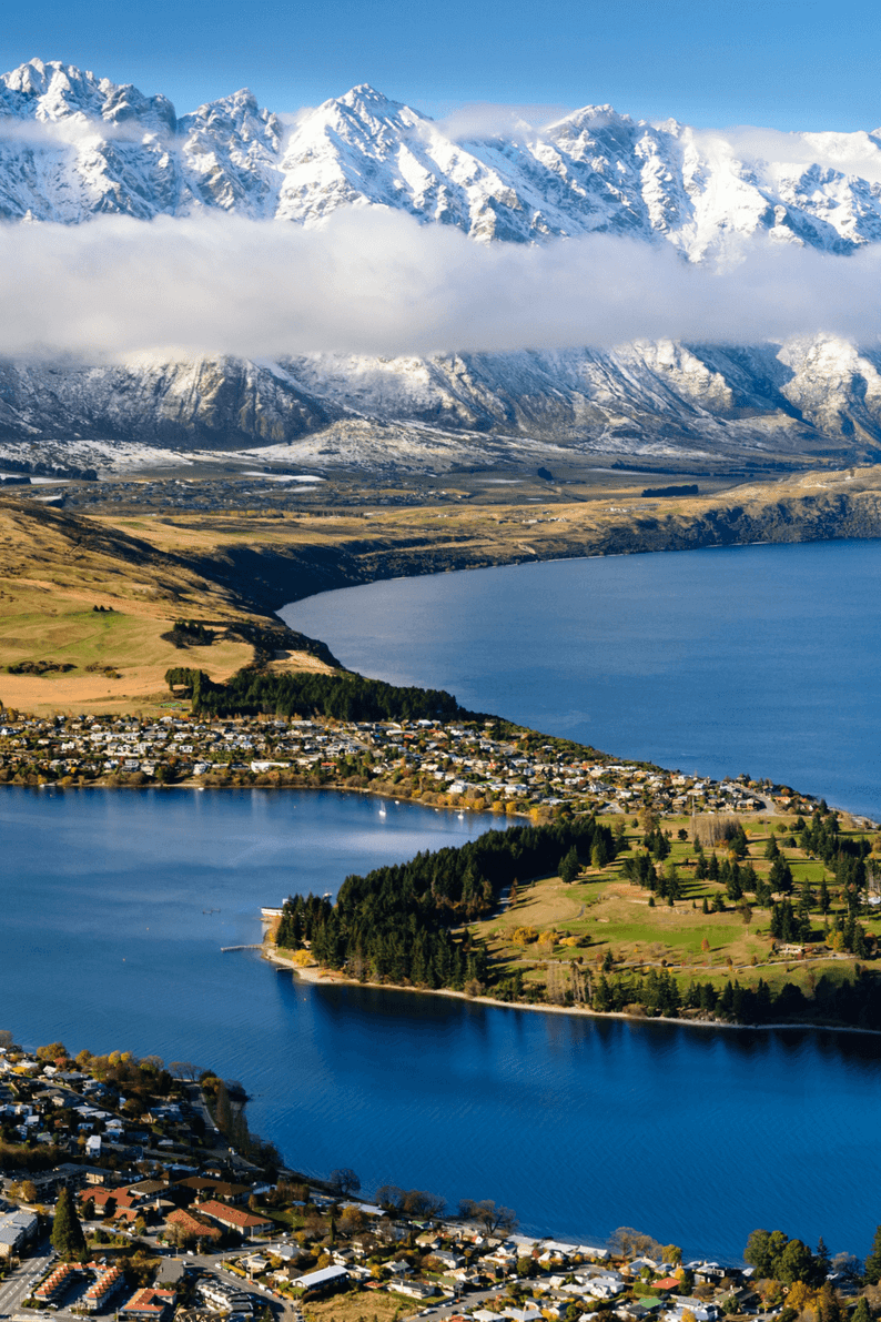 Stunning view of Lake Wakatipu and the snow-capped Remarkables mountain range in Queenstown, New Zealand.