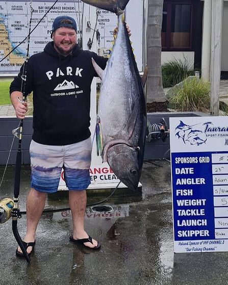 Adam holding fish and recorded stats
