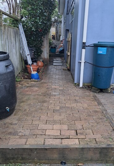 Paving stone pathway next to a house