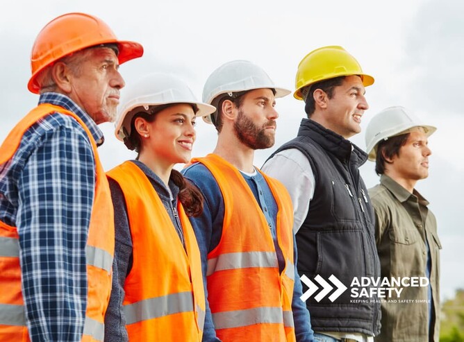 Confident workers wearing hard hats and safety equipment