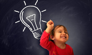 Small child with light bulb above head