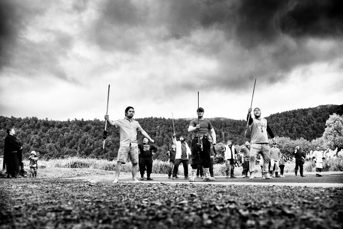 Waikaremoana men holding sticks