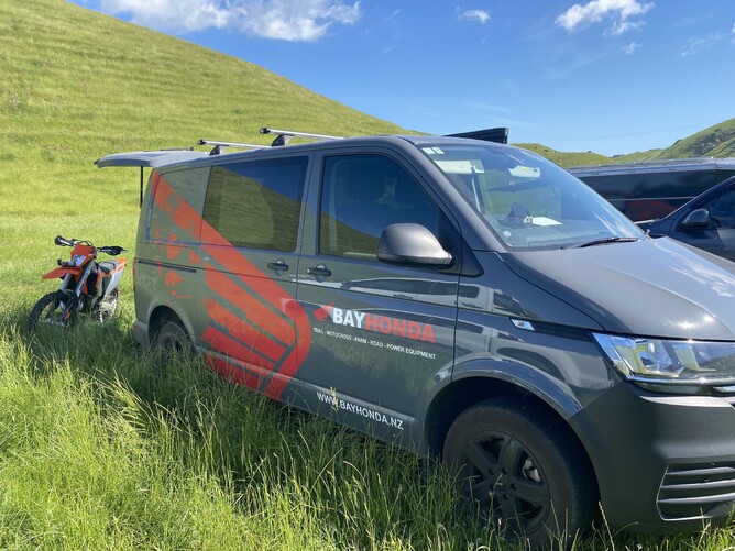 dark grey van with branding