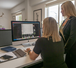 Two ladies looking at a computer