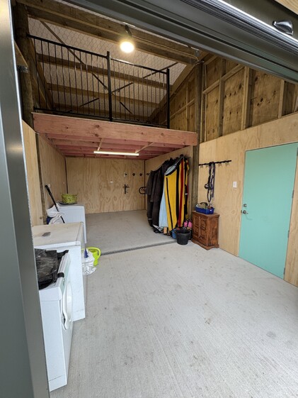custom tack room in 4 bay shed with horse stables