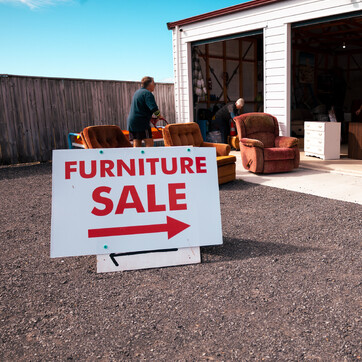 furniture with a furniture sale sign