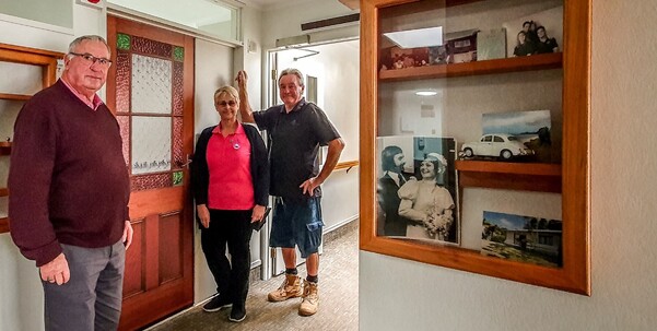 Don Harris (Chair of the Friends of Resthaven Foundation), Tracy Fairhall (Registered Diversional Therapist at Resthaven on Burns) and Jake Young (Resthaven Maintenance) beside the newly installed doors that are making a difference for residents living with dementia at Resthaven on Burns Care Centre.