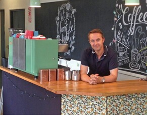 What kind of community would be a sign against the prevailing consumer ideology?