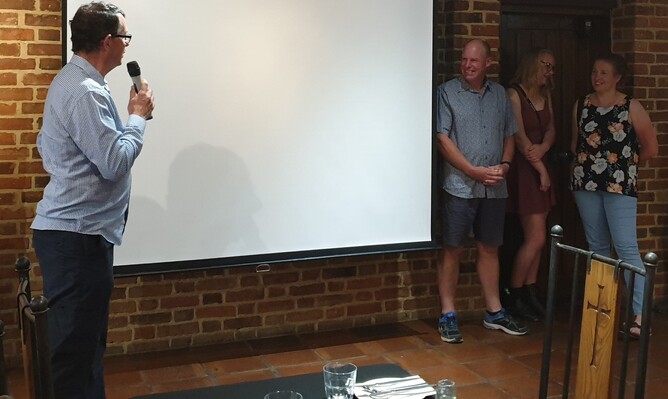 Paul and Jocelyn, and their daughter Jade, are welcomed to their surprise celebration.