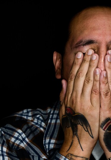 Man holding face