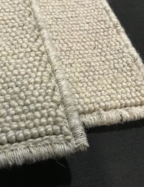 cream rug with binding, links to rug binding services