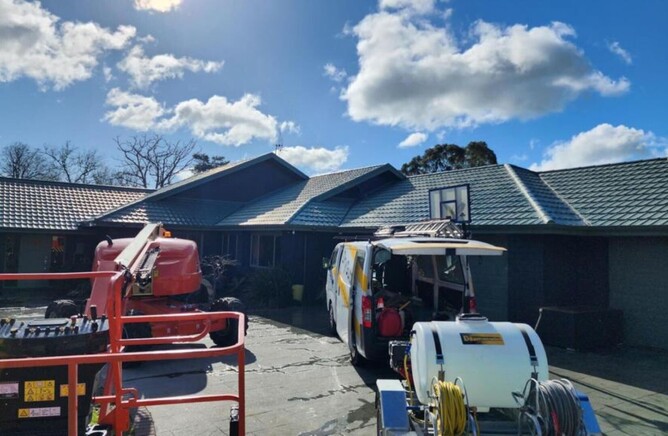 Dry gutts Hamilton house cleaning equipment and vehicle outside home